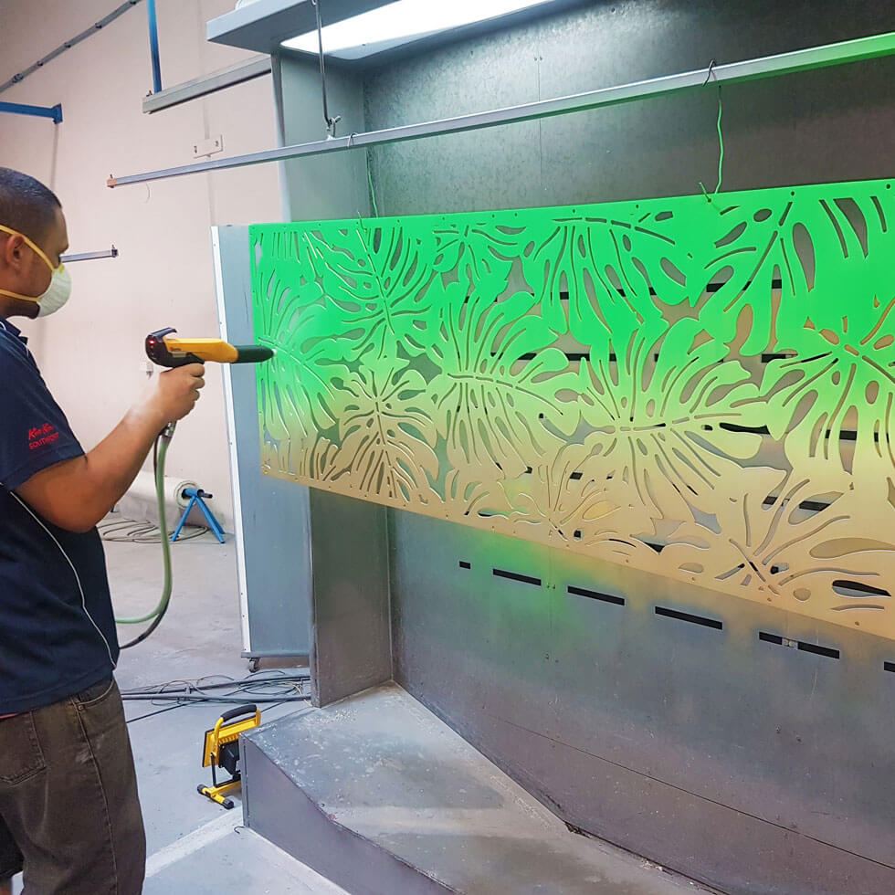 Powder coating a laser cut panel
